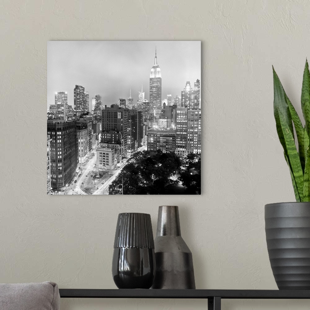 A modern room featuring View of Midtown Manhattan at night, as seen from 23rd Street.