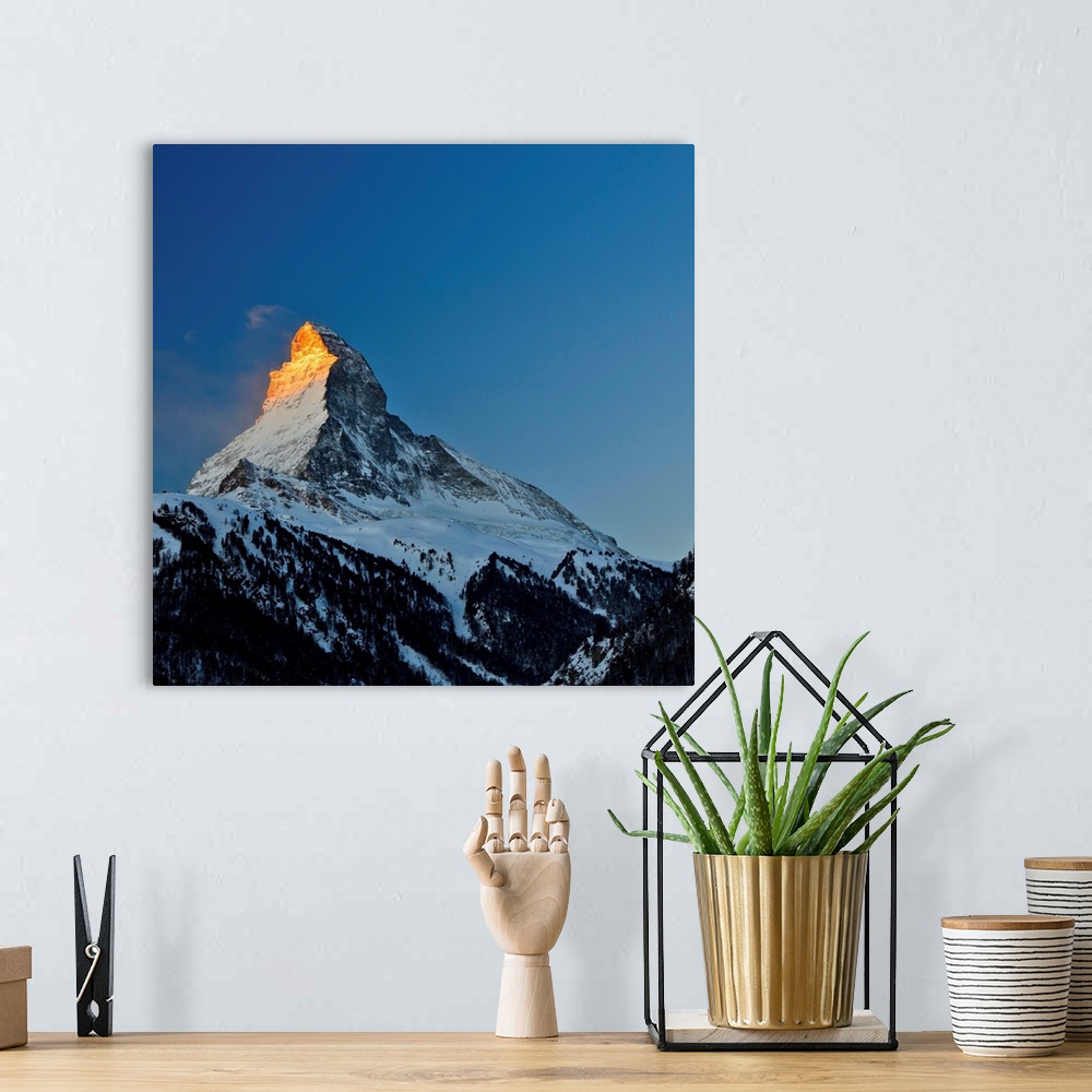 A bohemian room featuring View of Matterhorn, Alpes, in sunrise, blue sky in background.