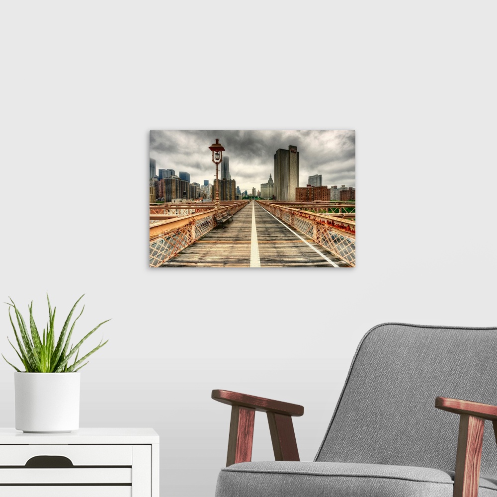 A modern room featuring The towering skyscrapers of New York City against a dark, cloudy sky, as seen from a weathered br...
