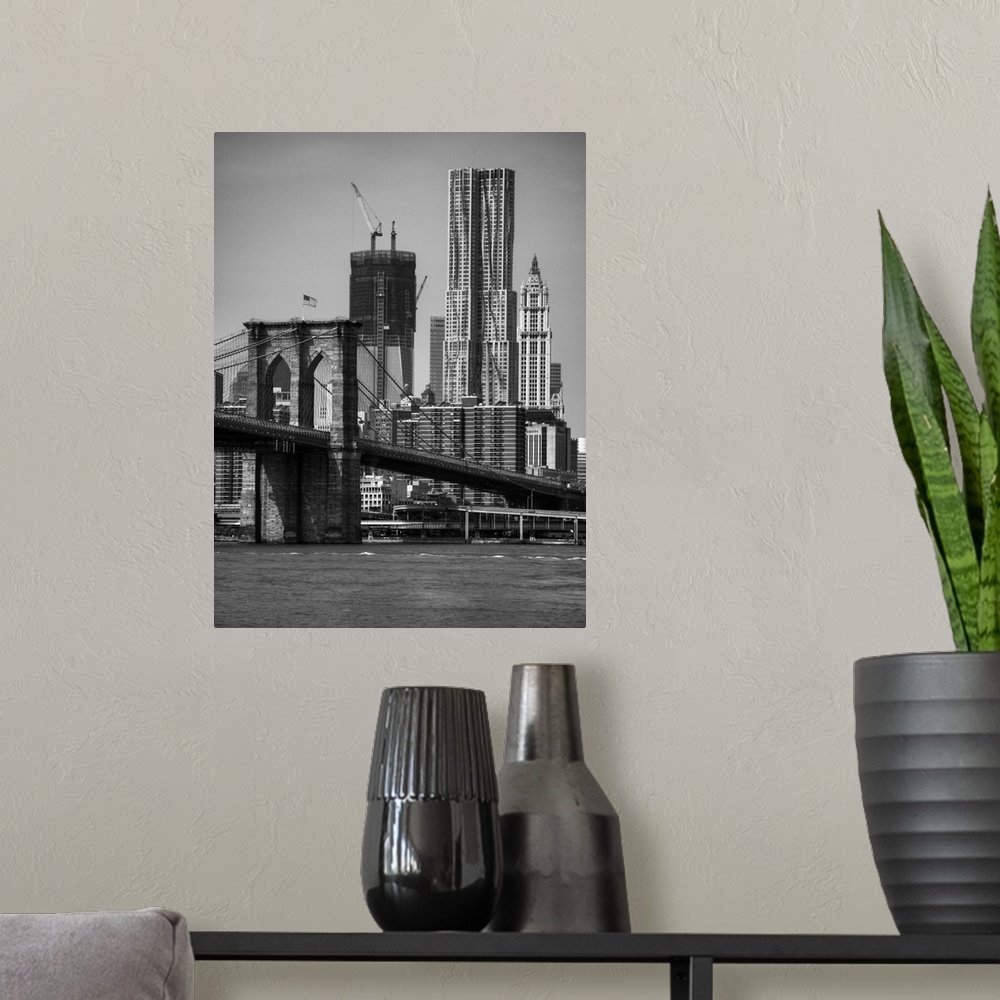 A modern room featuring View of One World Trade Center and brooklyn bridge in New York city skyline.