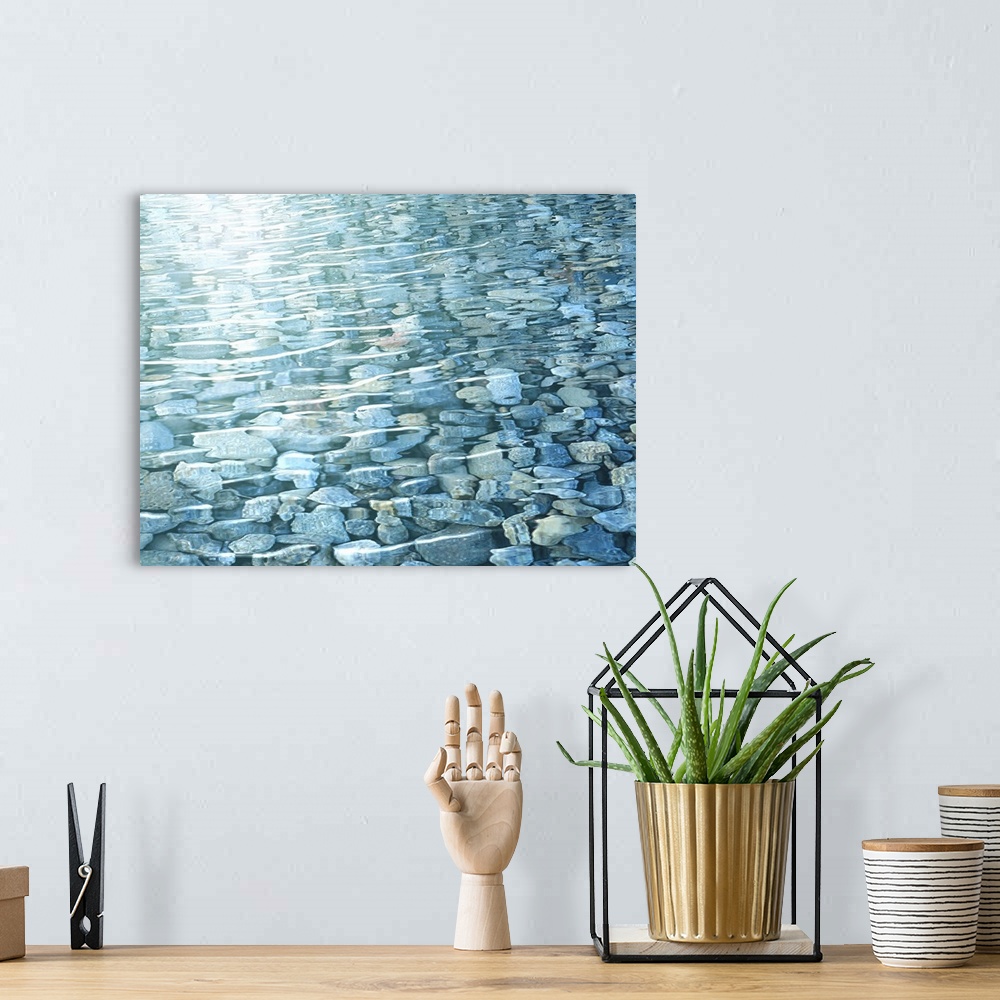 A bohemian room featuring View of rocks in water