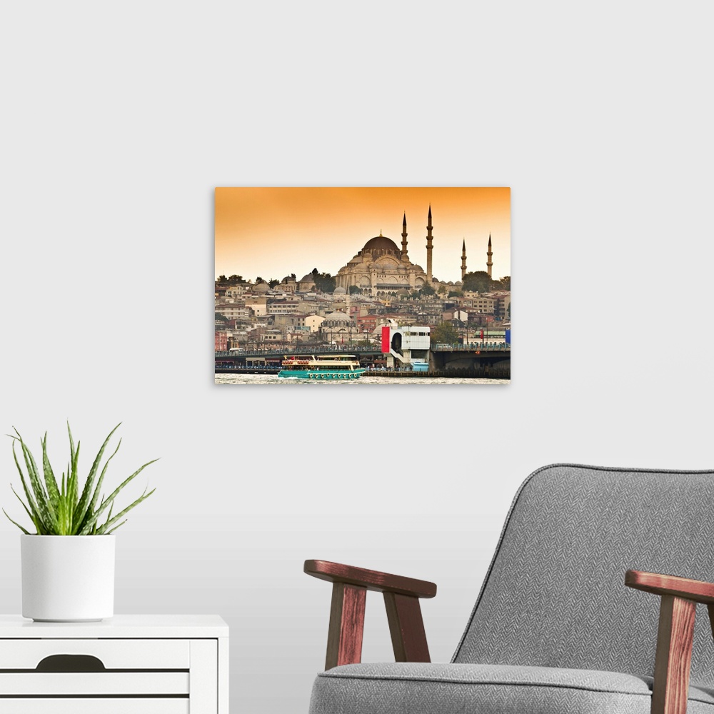 A modern room featuring View of Suleymaniye mosque and Galata bridge over Bosphorus strait in Istanbul, Turkey.
