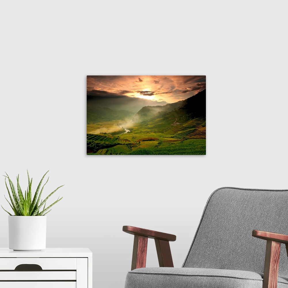 A modern room featuring Photograph of rolling hills and farmland with a winding lake and mountains in the background unde...