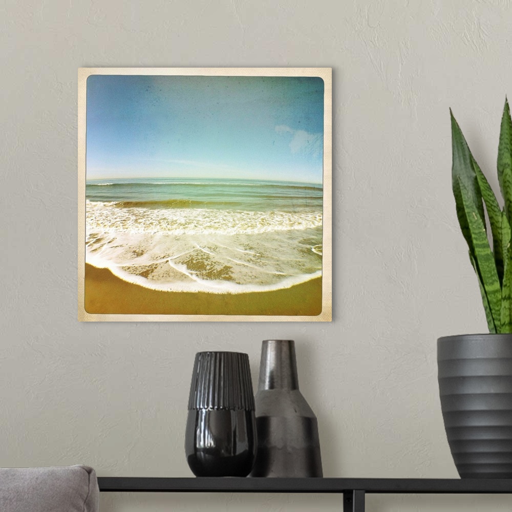 A modern room featuring View of tides as they roll onto sandy beach, California, US.