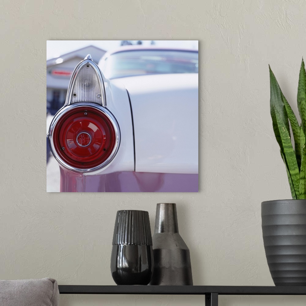 A modern room featuring Vintage American car, close-up of rear light and trunk