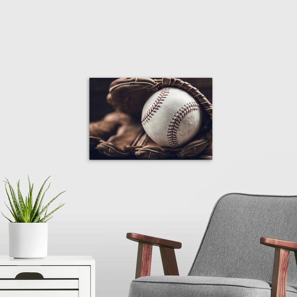 A modern room featuring A group of vintage baseball equipment, bats, gloves, baseballs on wooden background.