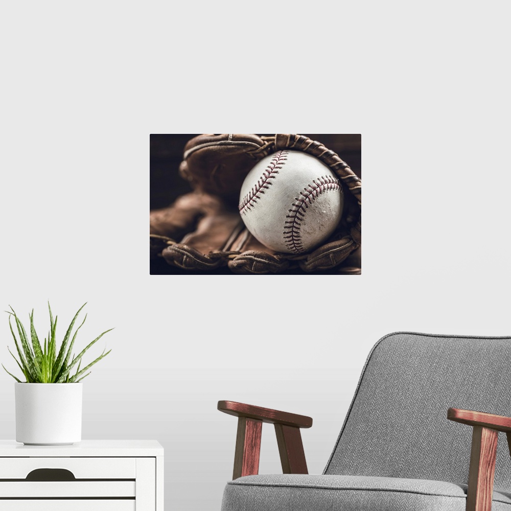 A modern room featuring A group of vintage baseball equipment, bats, gloves, baseballs on wooden background.