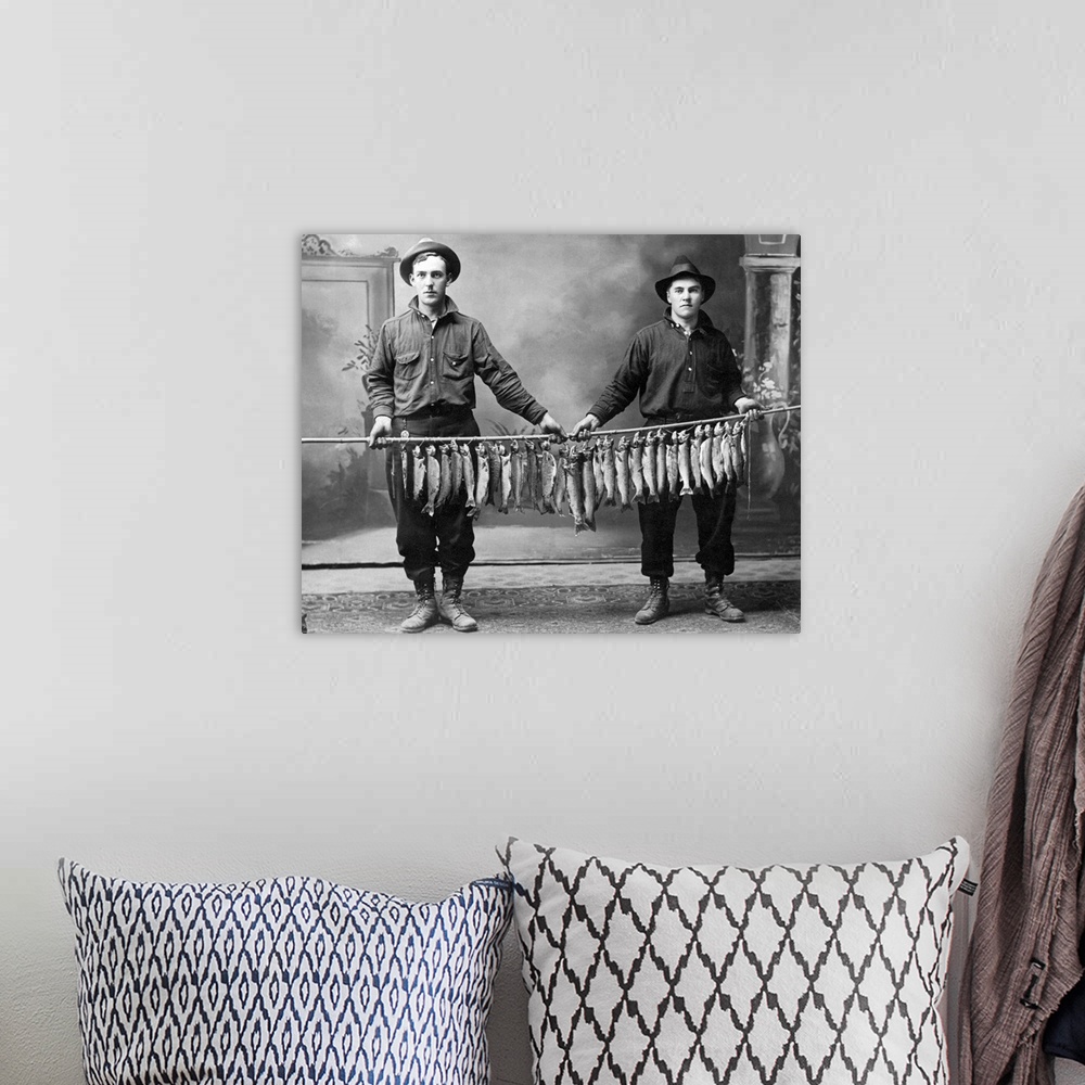A bohemian room featuring Vintage image of men holding string of fish