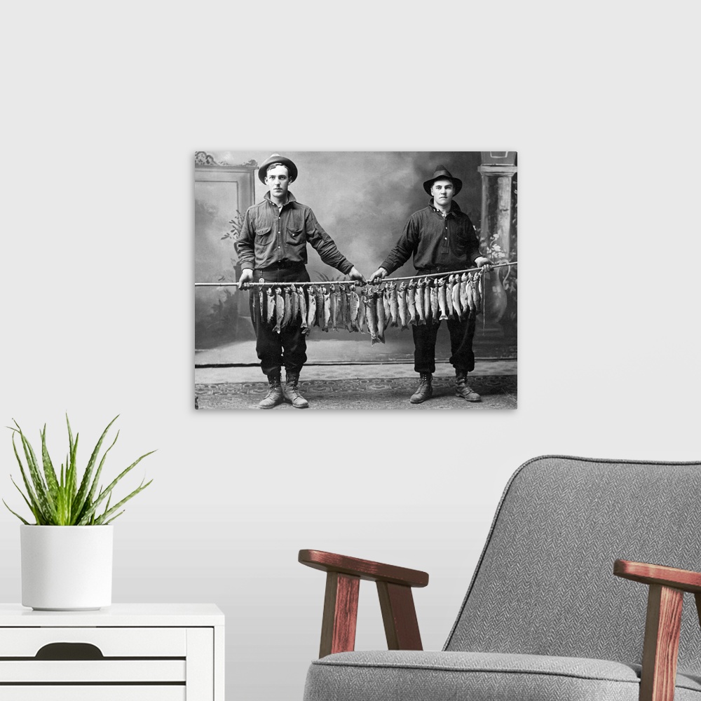 A modern room featuring Vintage image of men holding string of fish