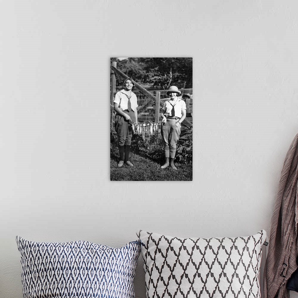 A bohemian room featuring Vintage image of women holding string of fish