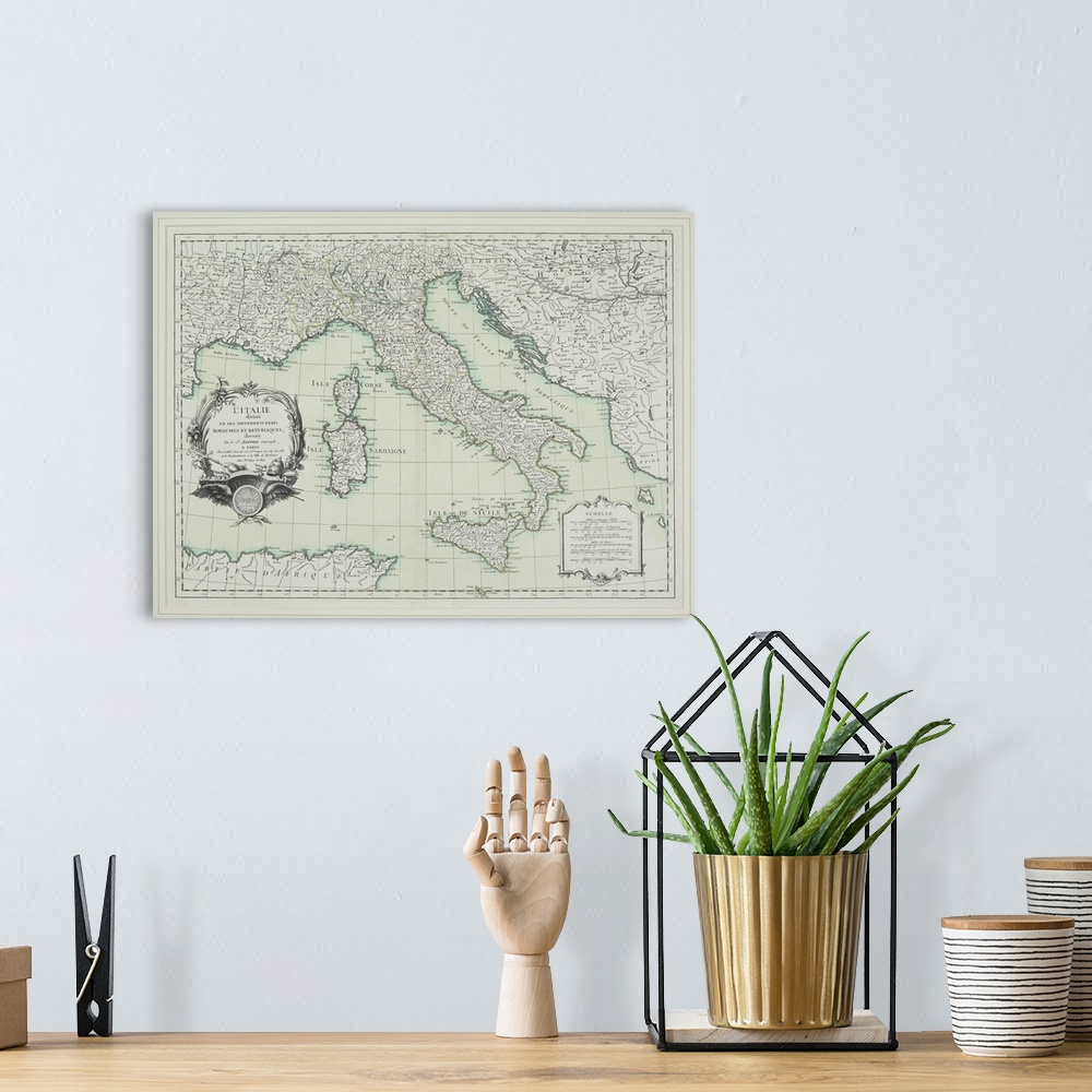 A bohemian room featuring Old French map of the Italian peninsula, including the islands of Corsica, Sardinia, and Sicily.