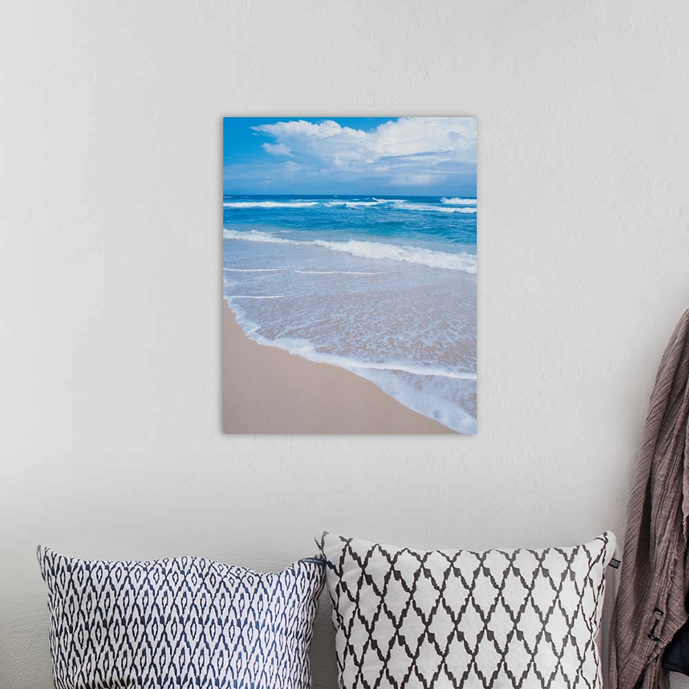 A bohemian room featuring Photograph of small waves lapping on the white sandy beach.