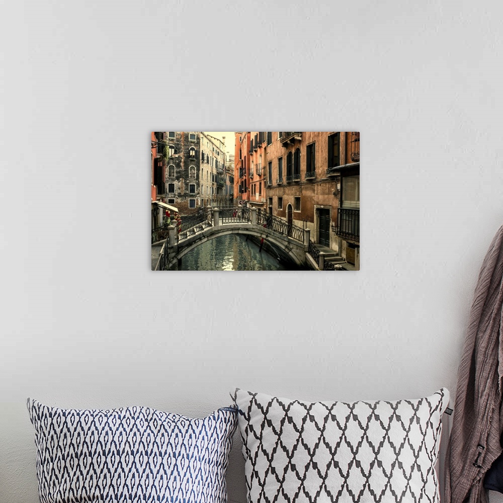 A bohemian room featuring Short bridge over one of the many canals that crisscross Venice.