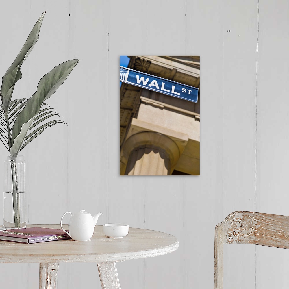 A farmhouse room featuring Wall Street sign