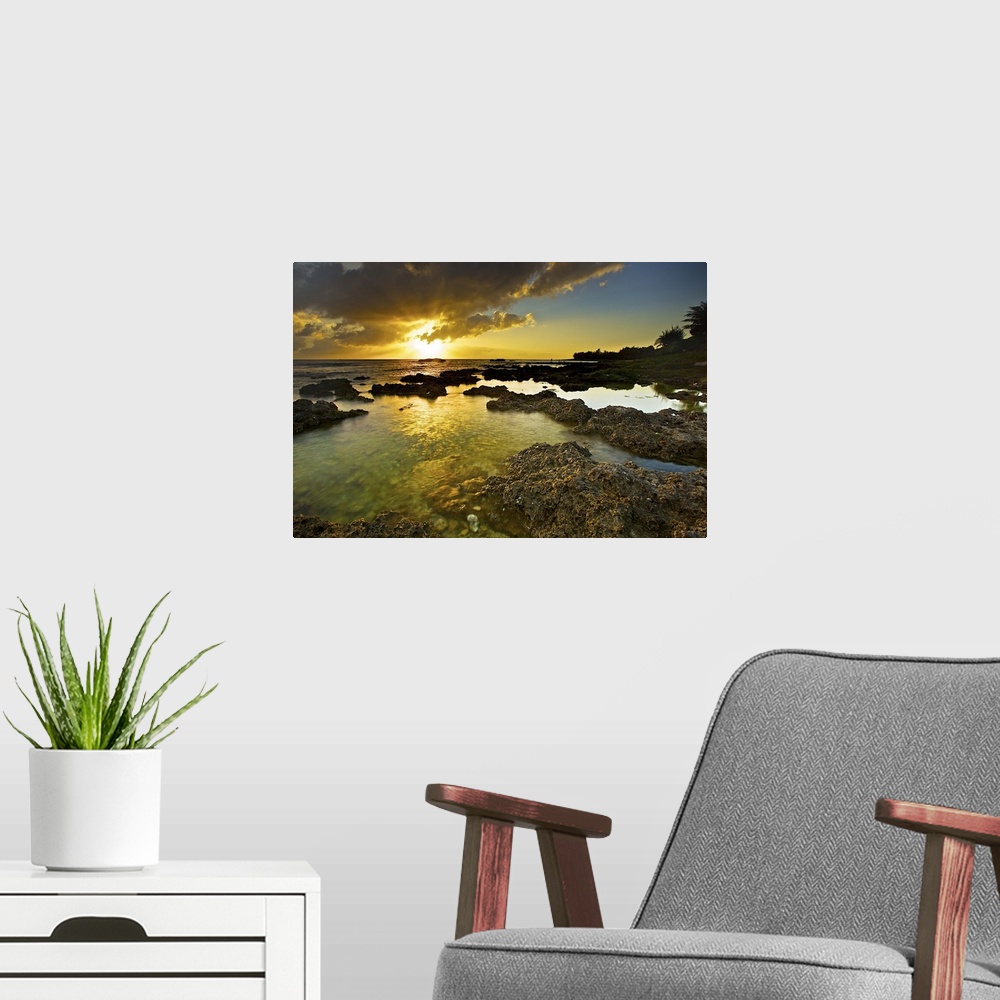 A modern room featuring Wanliton lagoon on golden sunny evening while sun beaming out near horizon to brighten up clear l...