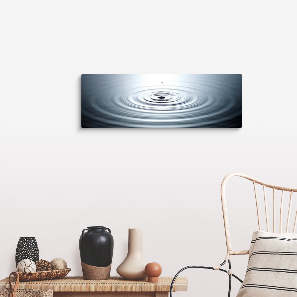 A farmhouse room featuring drop of water causing ripples in still pool of water