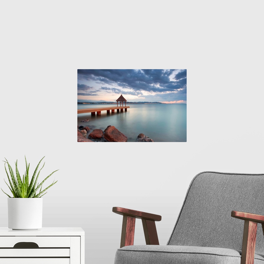 A modern room featuring Water-scape sunrise.