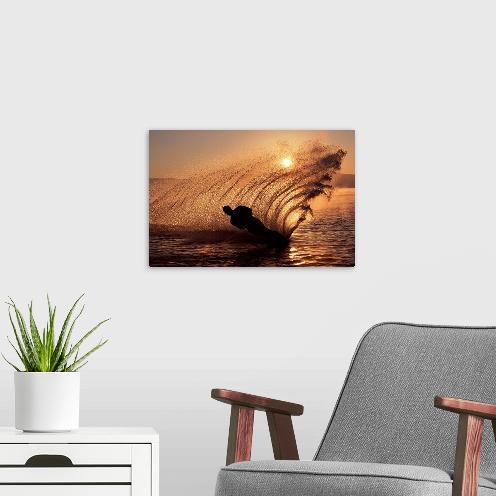A modern room featuring Water-skier at sunset sending up spray of water