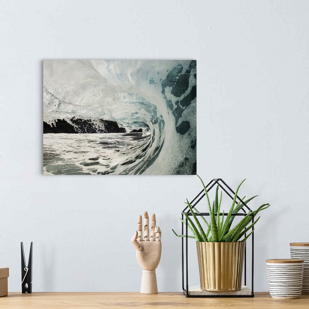 A bohemian room featuring Wave breaking over shallow reef.