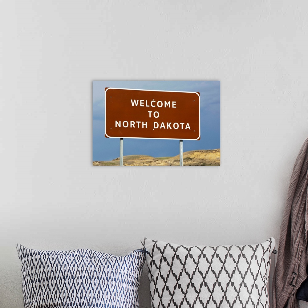 A bohemian room featuring Welcome To North Dakota Sign