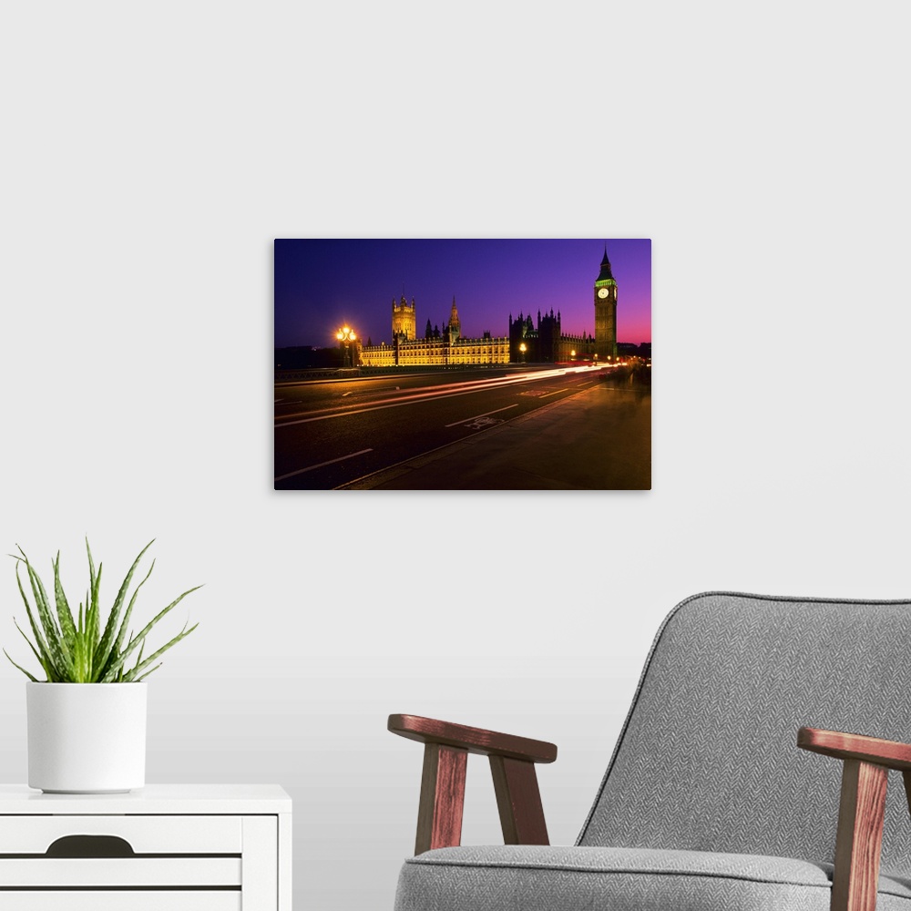 A modern room featuring Westminster Bridge, Houses of Parliament and Big Ben Clock Tower at night, London, United Kingdom...