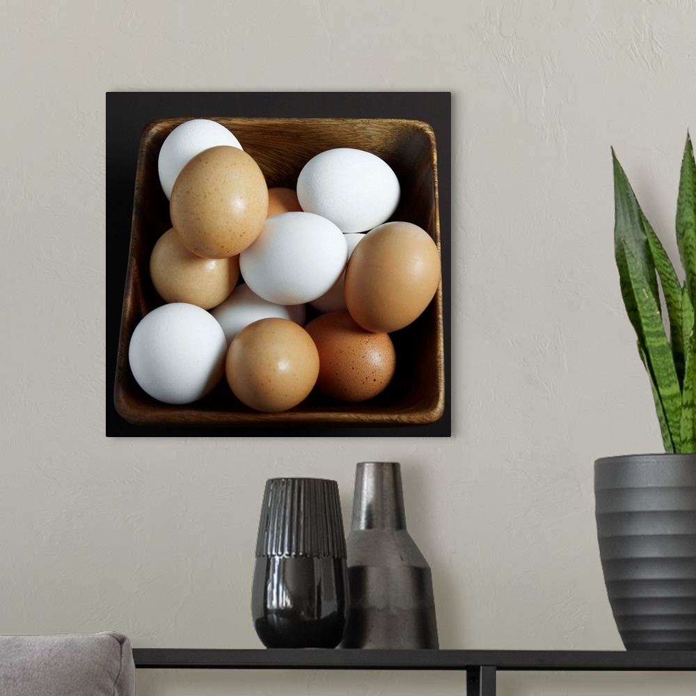 A modern room featuring White And Brown Eggs In Basket