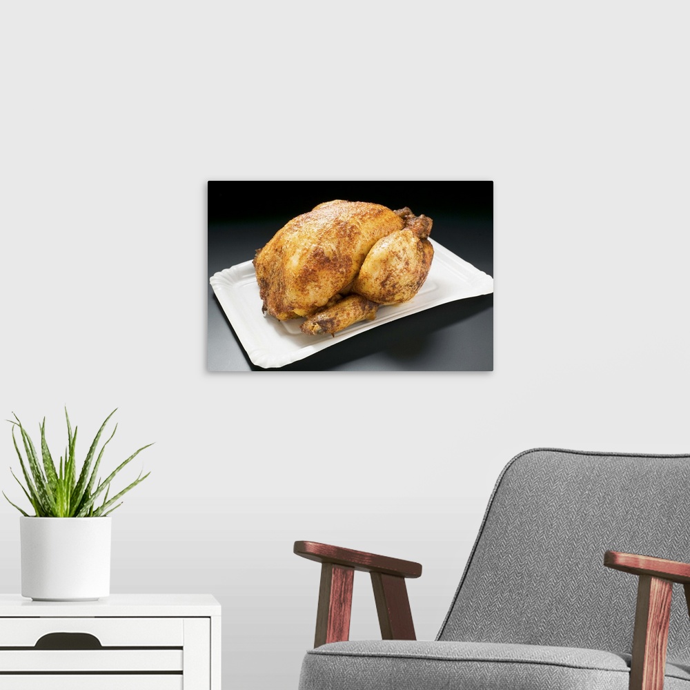 A modern room featuring Whole roast chicken on paper plate