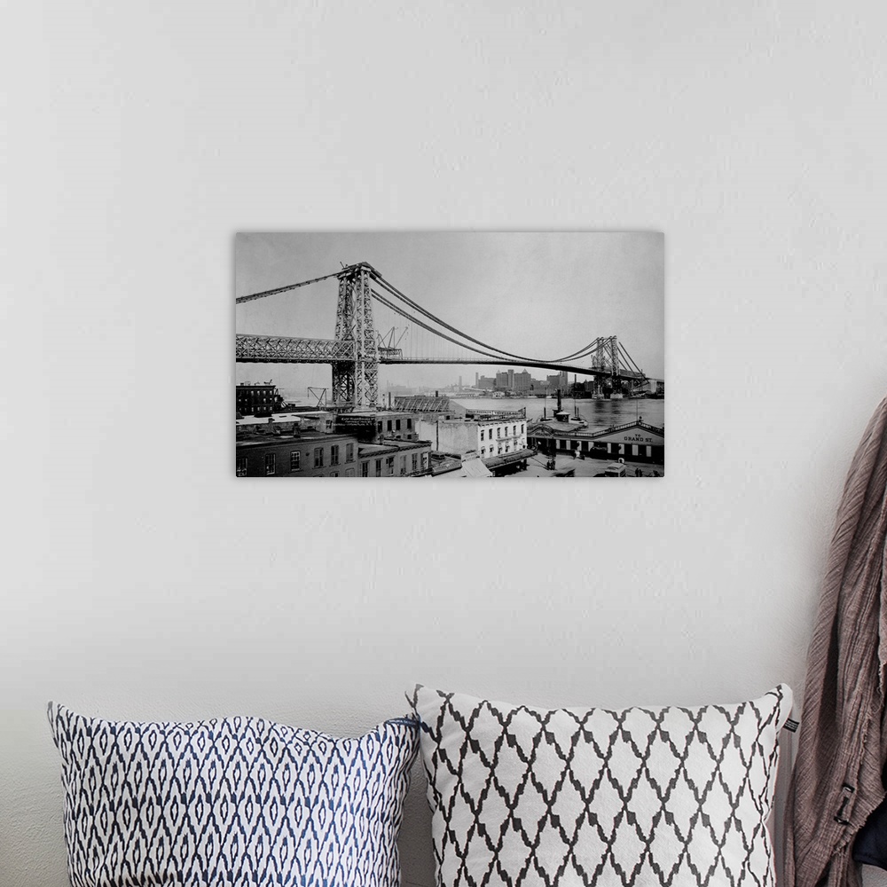 A bohemian room featuring The Williamsburg bridge extends from Delancy Street in the East Village across the East River to ...