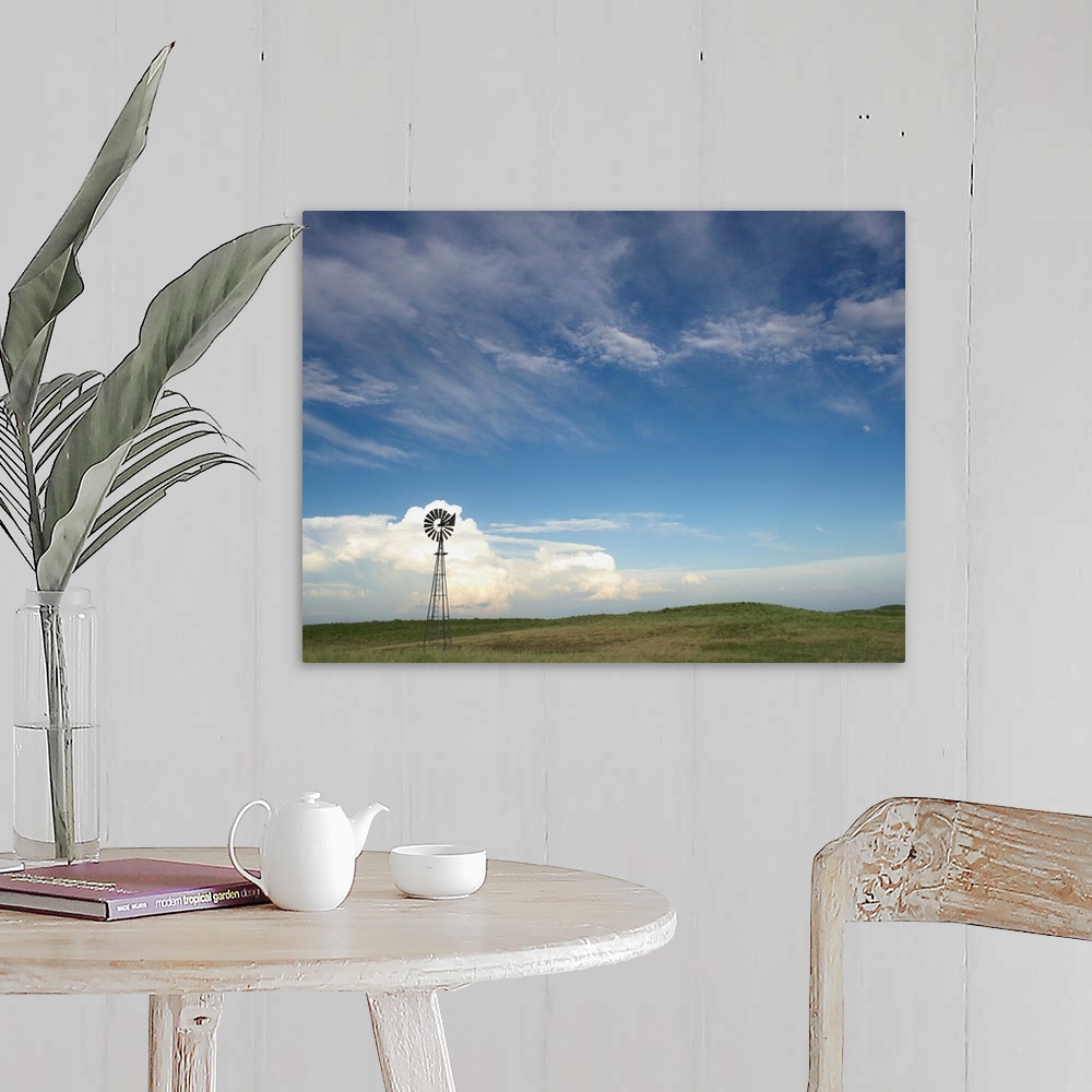 A farmhouse room featuring Windmill in field