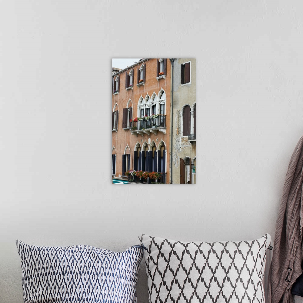 A bohemian room featuring Window boxes hanging on the railings of windows, Venice, Italy