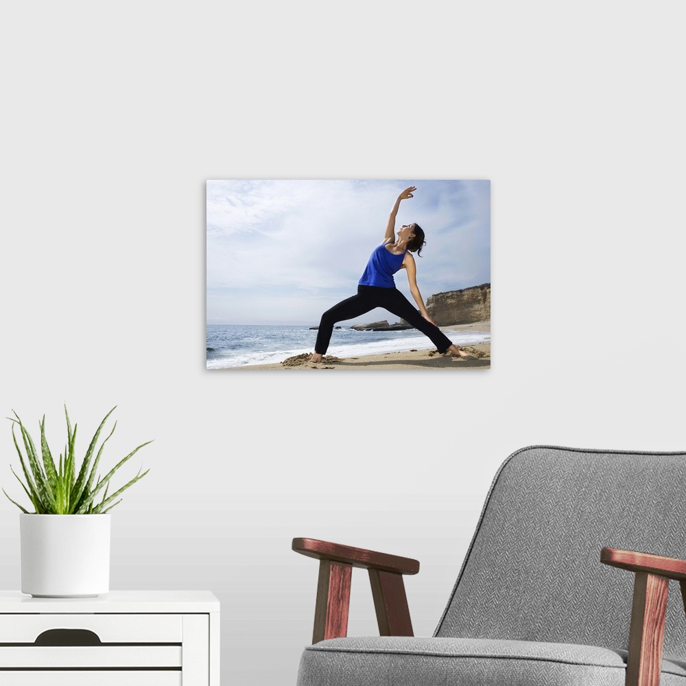 A modern room featuring Woman doing yoga on beach