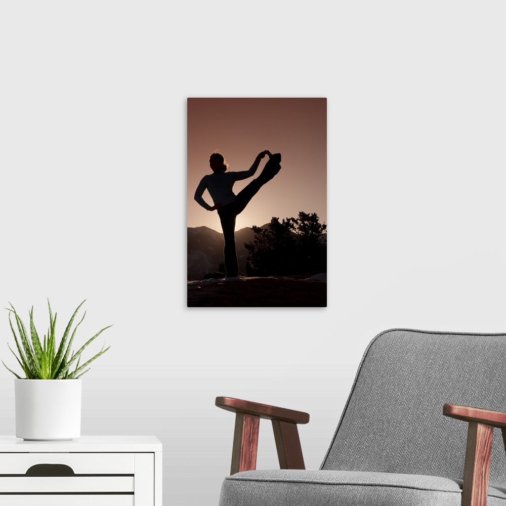 A modern room featuring Woman doing yoga outdoors