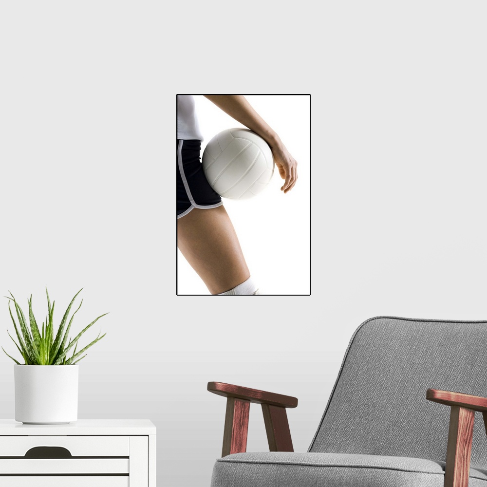 A modern room featuring woman playing volleyball