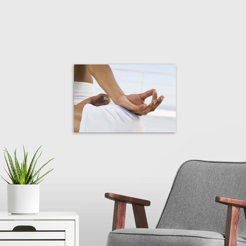A modern room featuring Woman practicing yoga