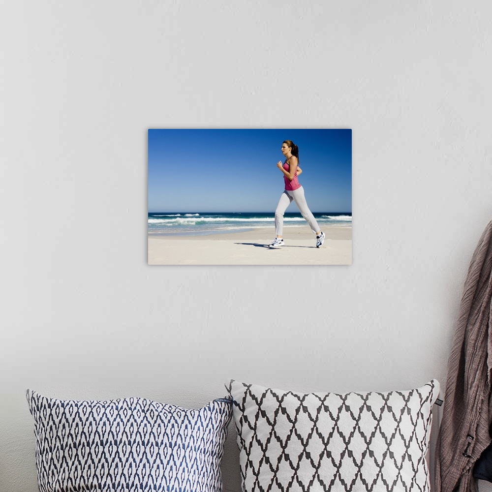 A bohemian room featuring Woman running on beach