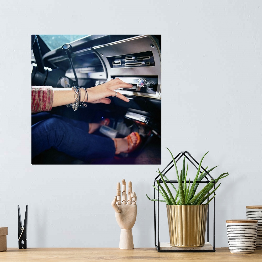 A bohemian room featuring Woman Using Car Stereo