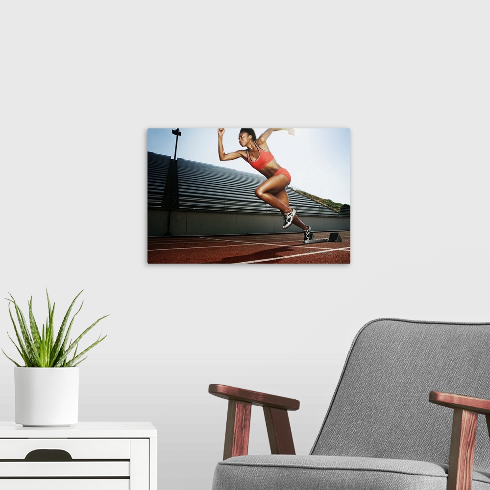 A modern room featuring Women running on athletic track