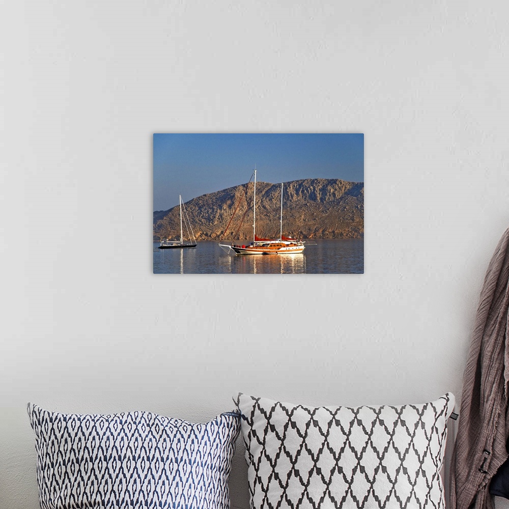 A bohemian room featuring Symi also transliterated Syme or Simi is a Greek island and municipality. It is mountainous and i...