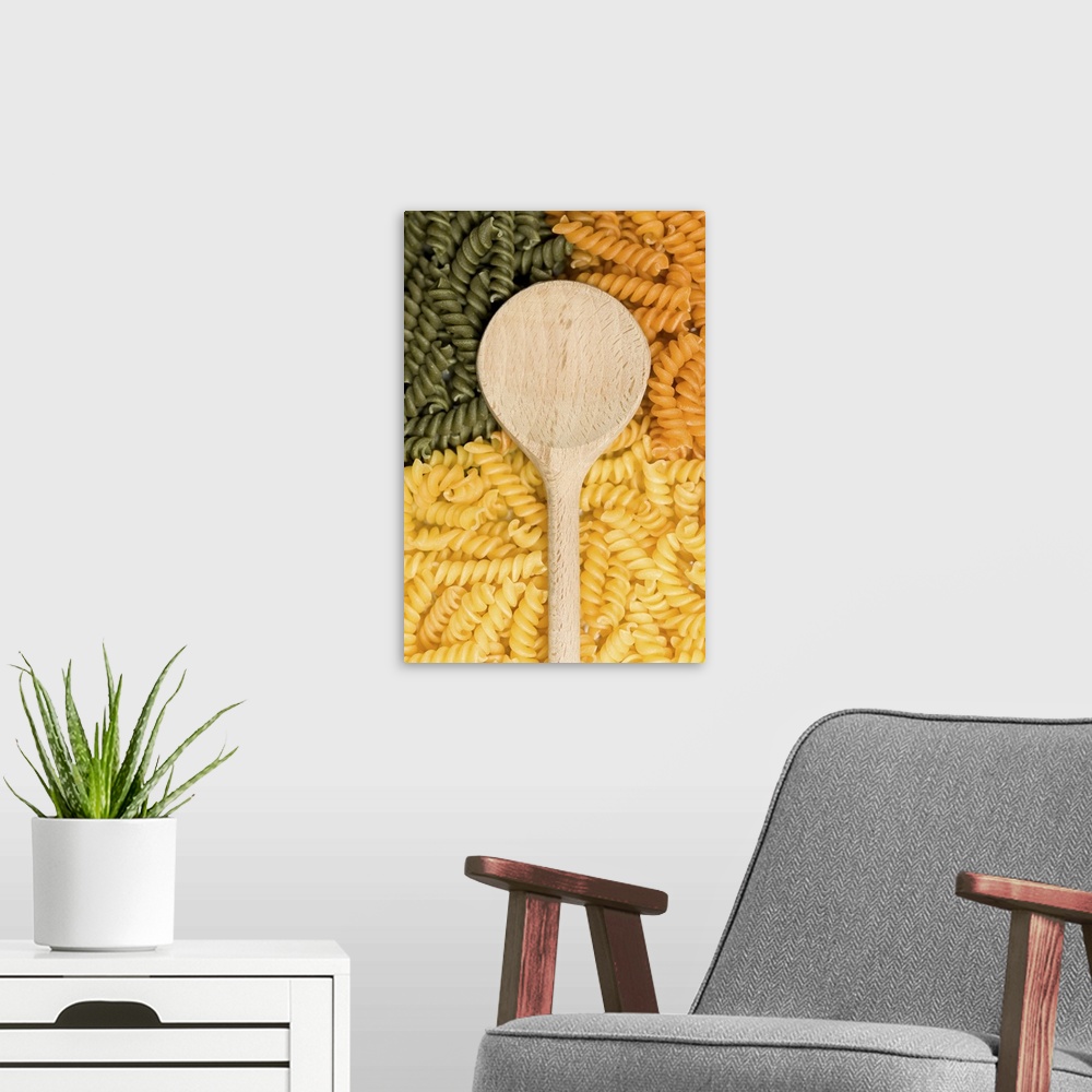 A modern room featuring Wooden spoon, green and yellow noodles