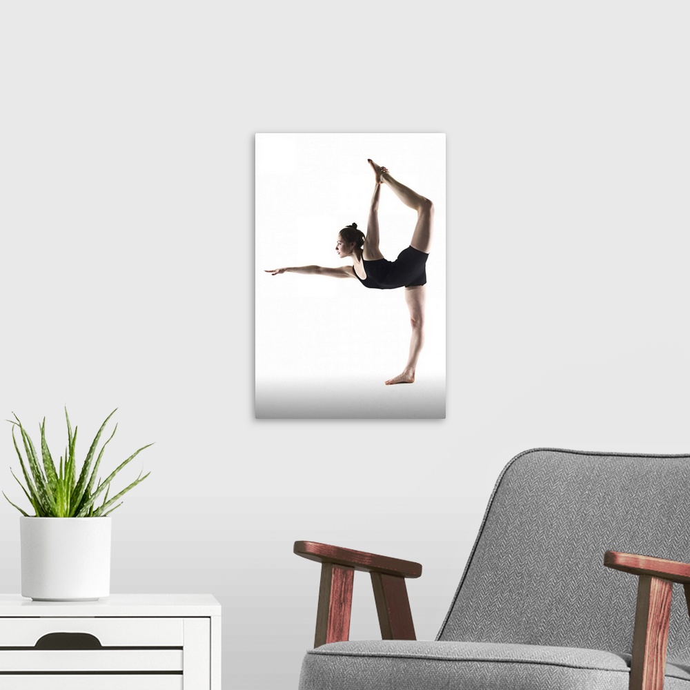 A modern room featuring Young woman standing yoga pose on white background.