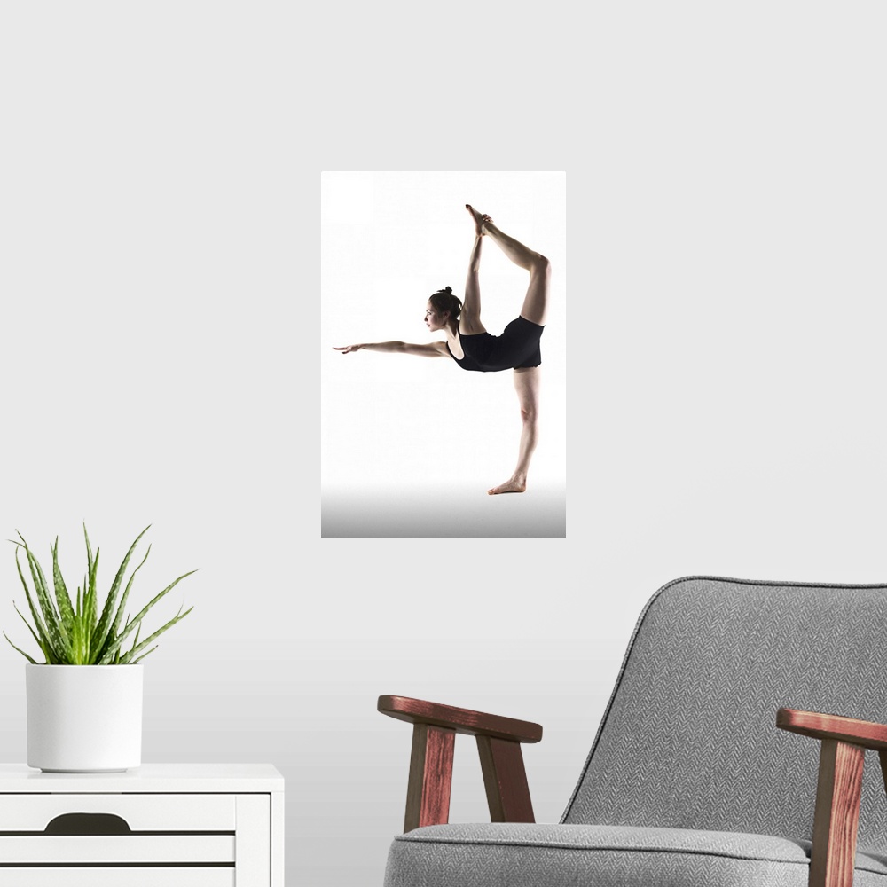 A modern room featuring Young woman standing yoga pose on white background.