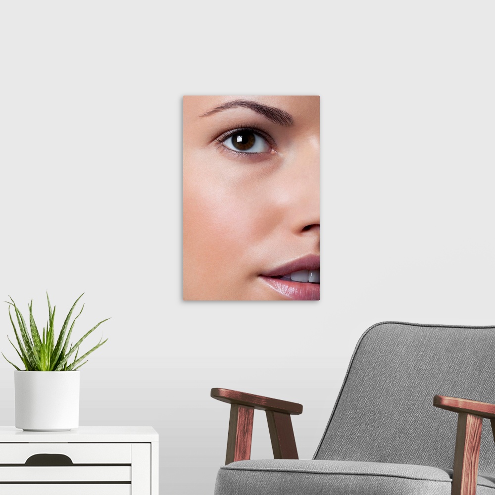 A modern room featuring Young woman with healthy, beautiful face, close up.