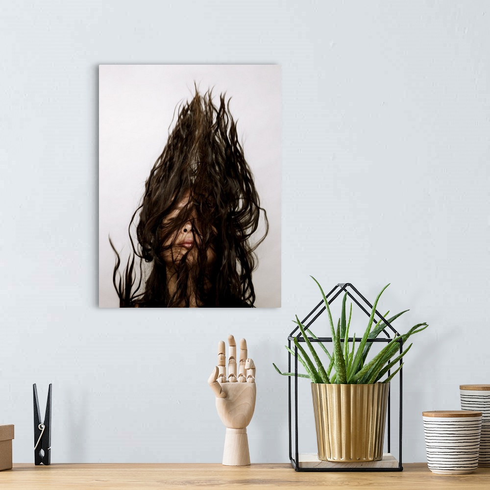 A bohemian room featuring Young asian woman flipping her hair in the air