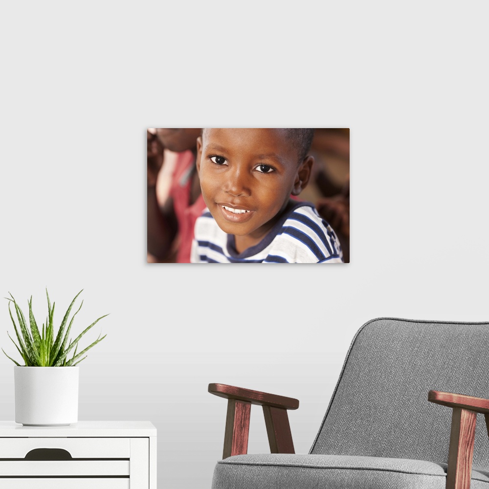 A modern room featuring Portrait of a young 5-7 male in Haiti smiling