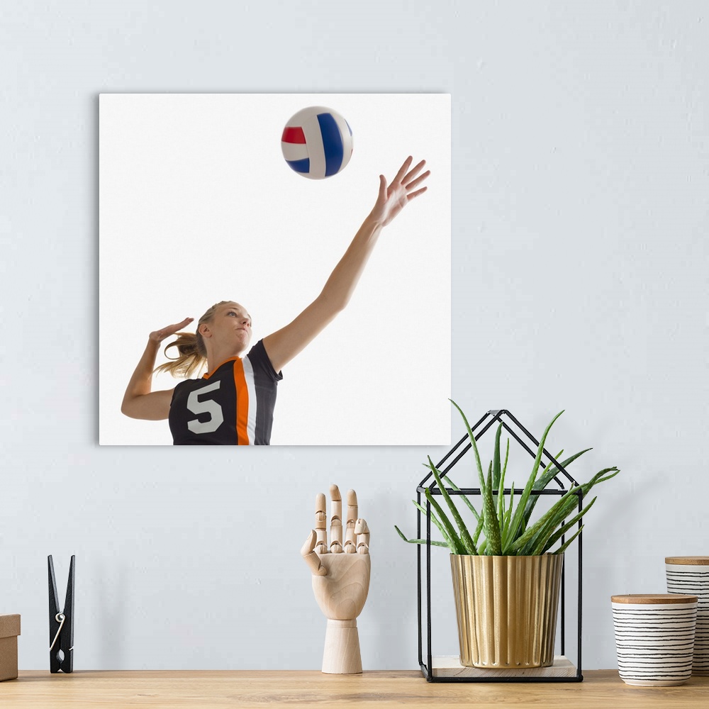 A bohemian room featuring Young girl (16-17) playing volleyball