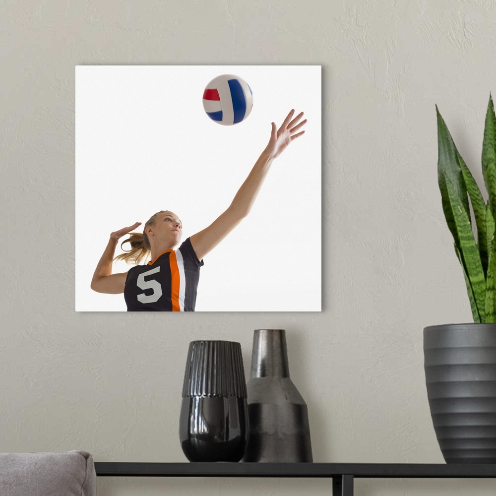 A modern room featuring Young girl (16-17) playing volleyball