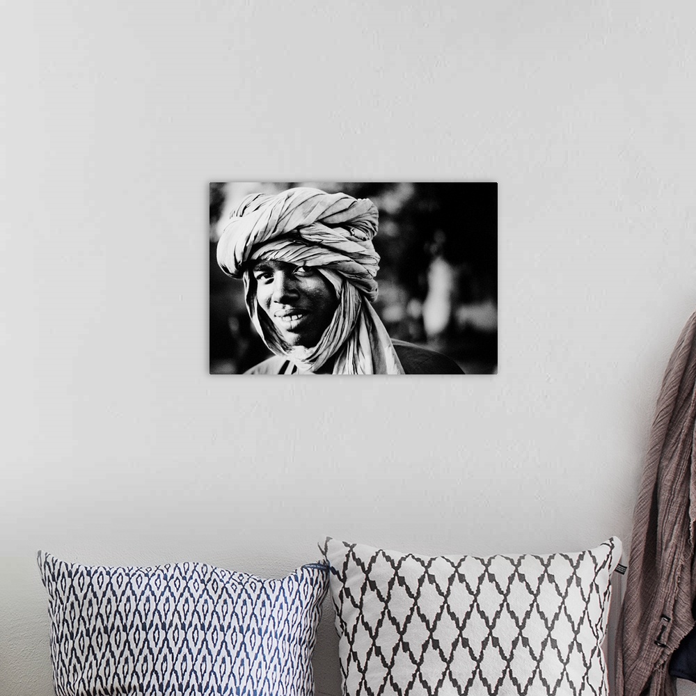 A bohemian room featuring Young man wearing turban, portrait