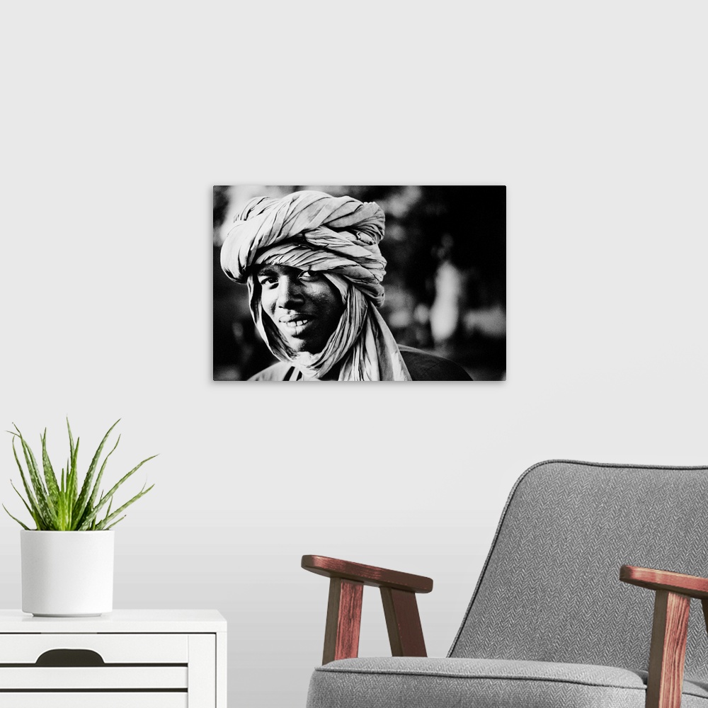 A modern room featuring Young man wearing turban, portrait