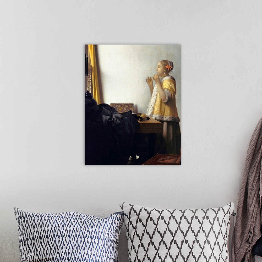 A bohemian room featuring Jan Vermeer (Dutch, 1632?1675), Young Woman with a Pearl Necklace, circa 1662. Oil on canvas, 45 ...