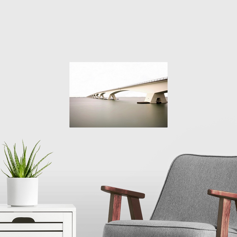 A modern room featuring Zeeland Bridge the longest bridge in Netherlands.